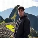 A solo traveler, David Chen, looking proud at Machu Picchu.