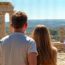Emily and Ben exploring an ancient ruin in Greece.